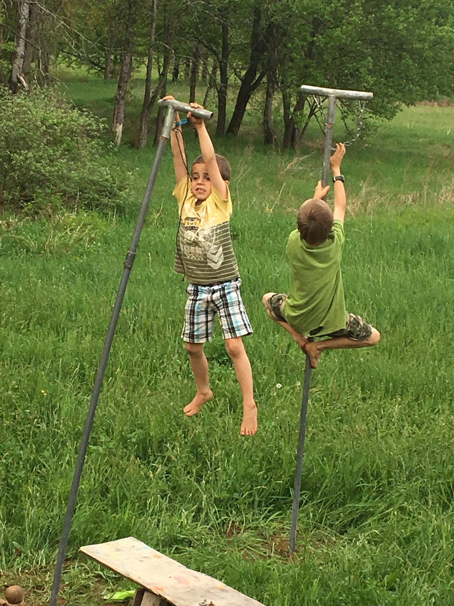 Children playing freely in nature as part of a simple living childhood.