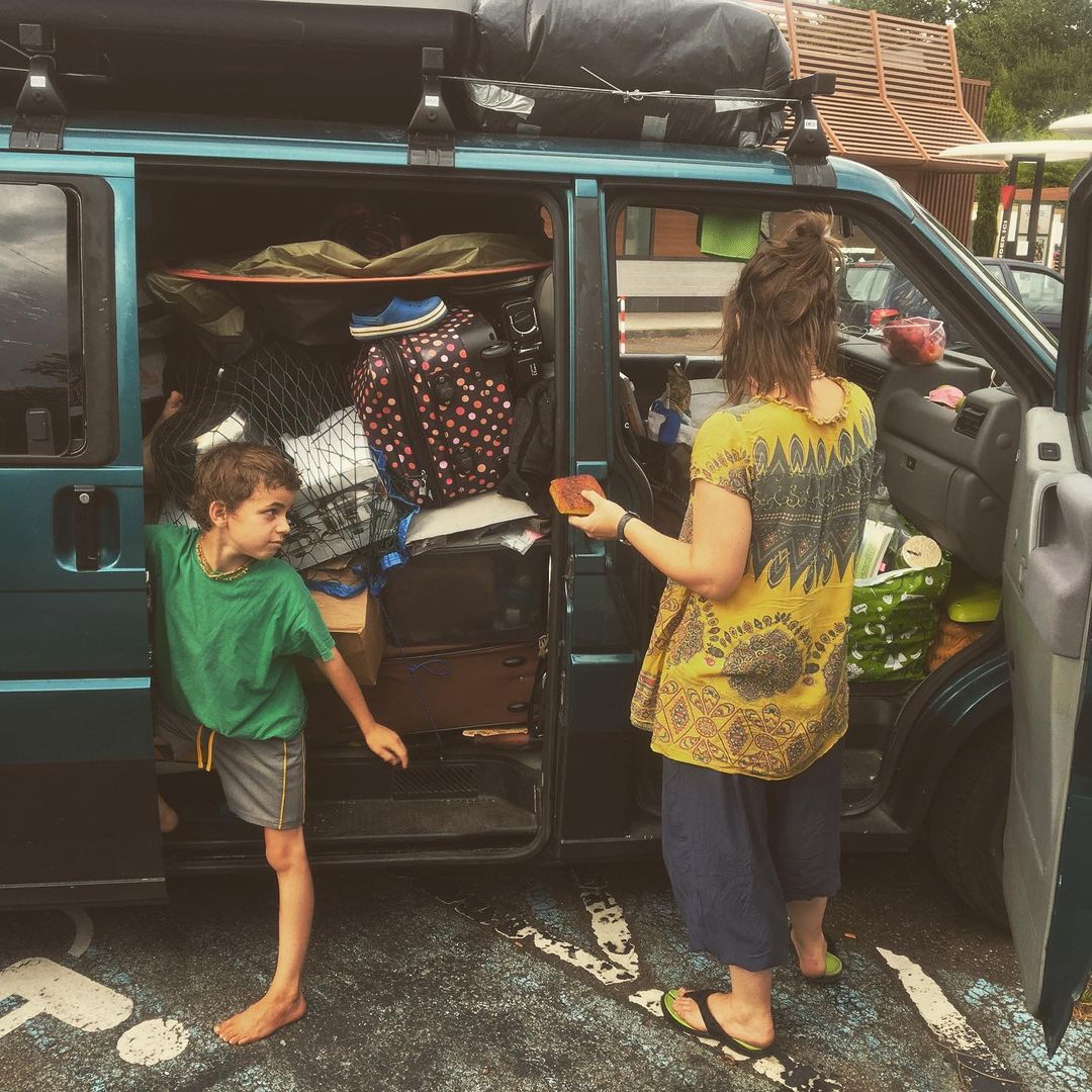 Family packing their campervan — the beginning of a simpler life